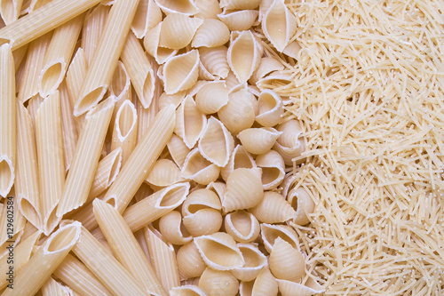 feathers, bows pasta or macaroni and vermicelli background, text