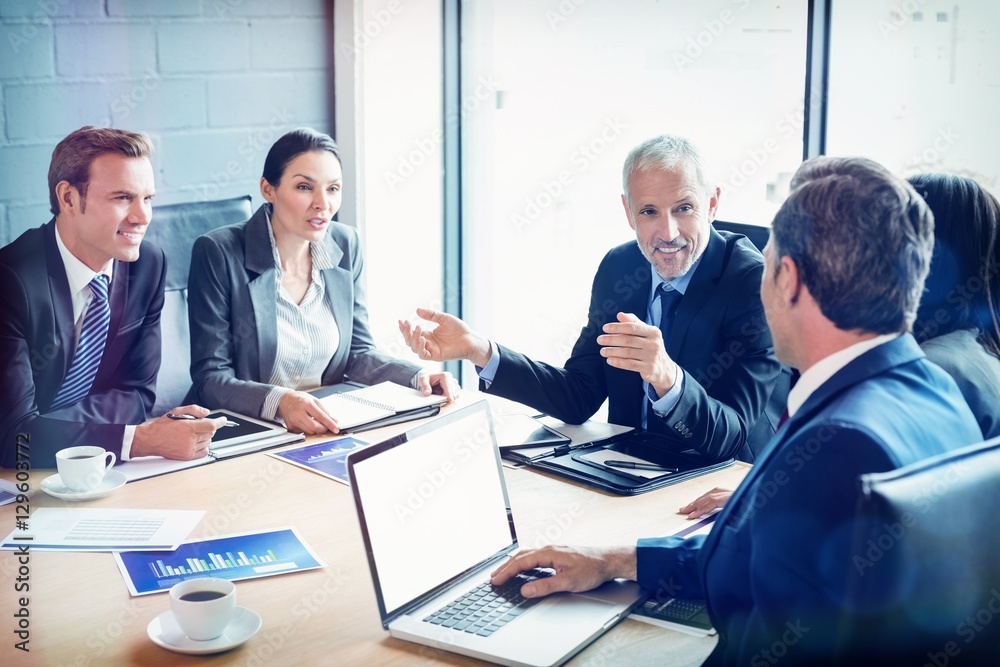 Businesspeople discussing together in conference room Businesspeople discussing together in conference room