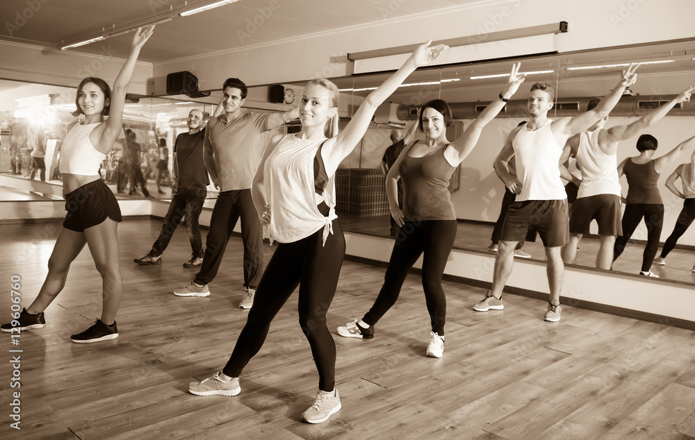 Young people learning zumba steps
