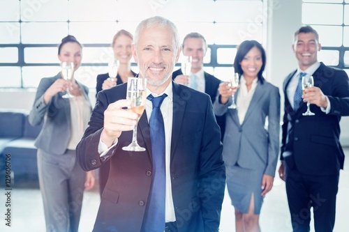 Portrait of businessman holding champagne flute