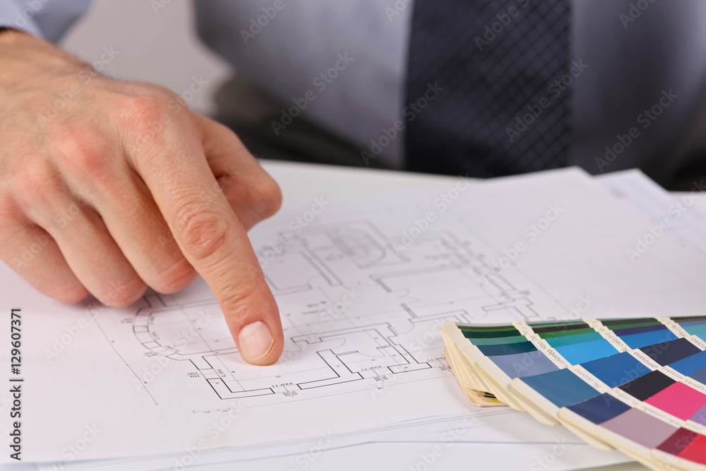 Architect pointing on project drawing, Project Manager showing house plans. Interior designer consultation Architect pointing on project drawing, Project Manager showing house plans. Interior designer consultation