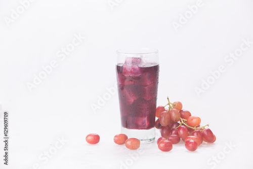 Grape juice in a glass with ice.