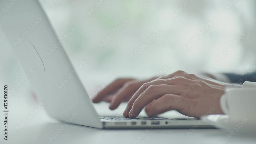 Man typing on a keyboard Man typing on a keyboard