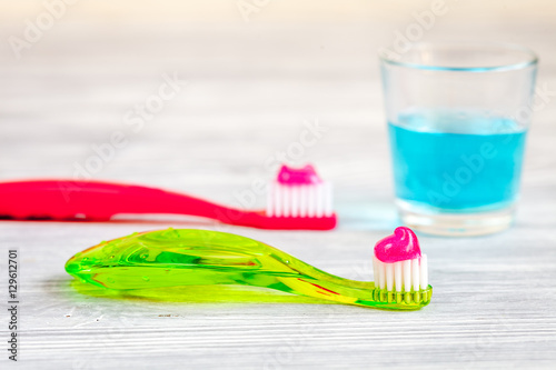 children s toothbrush oral care on wooden background