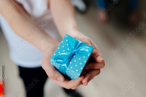 Little child giving present.