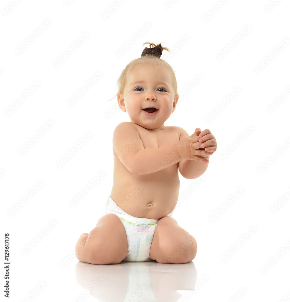 Infant child baby girl toddler sitting smiling laughing looking Infant child baby girl toddler sitting smiling laughing looking