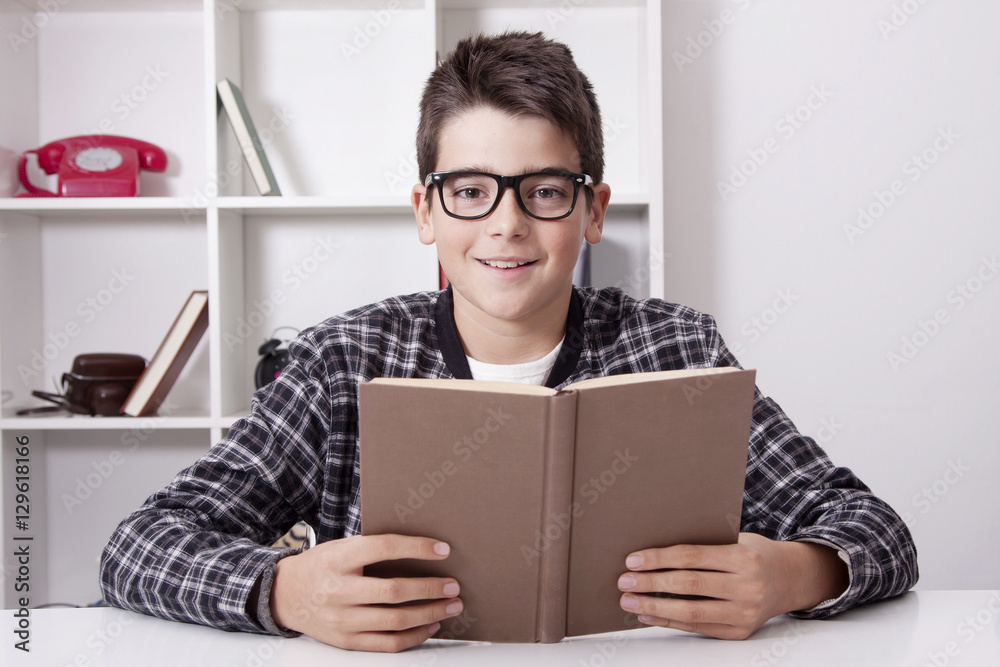 child at home with the book studying or reading child at home with the book studying or reading