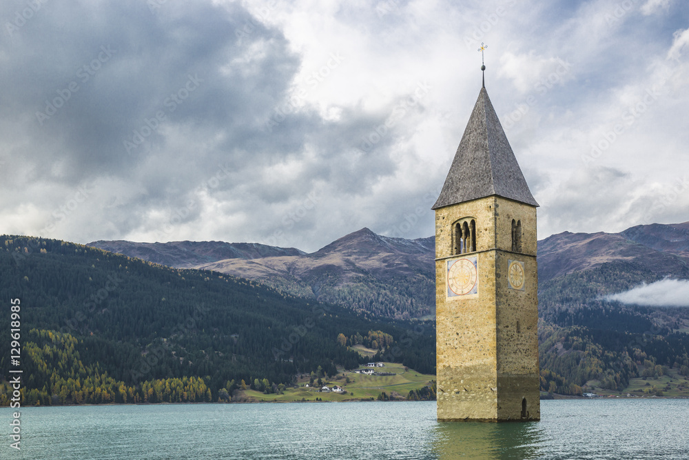 Curon bell tower emerges from the lake Resia - South Tyrol (Italy)