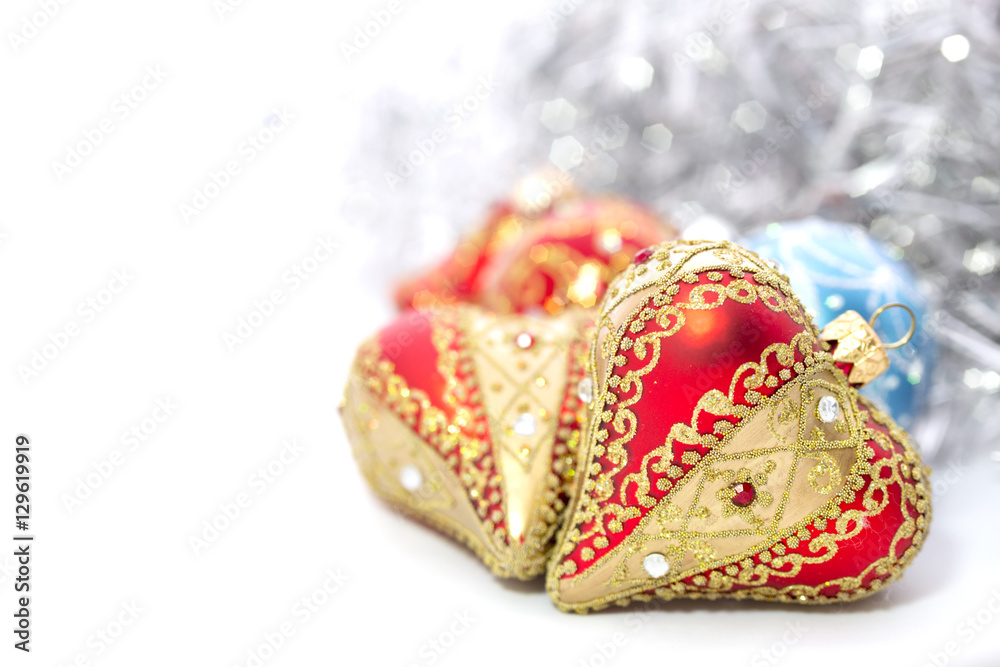 Fototapeta premium Closeup of red Christmas balls heart