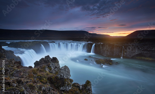 The rapid flow of water powerful Godafoss cascade. Popular tourist attraction. Unusual and gorgeous scene. Location Bardardalur valley, Skjalfandafljot river, Iceland, Europe. Beauty world.