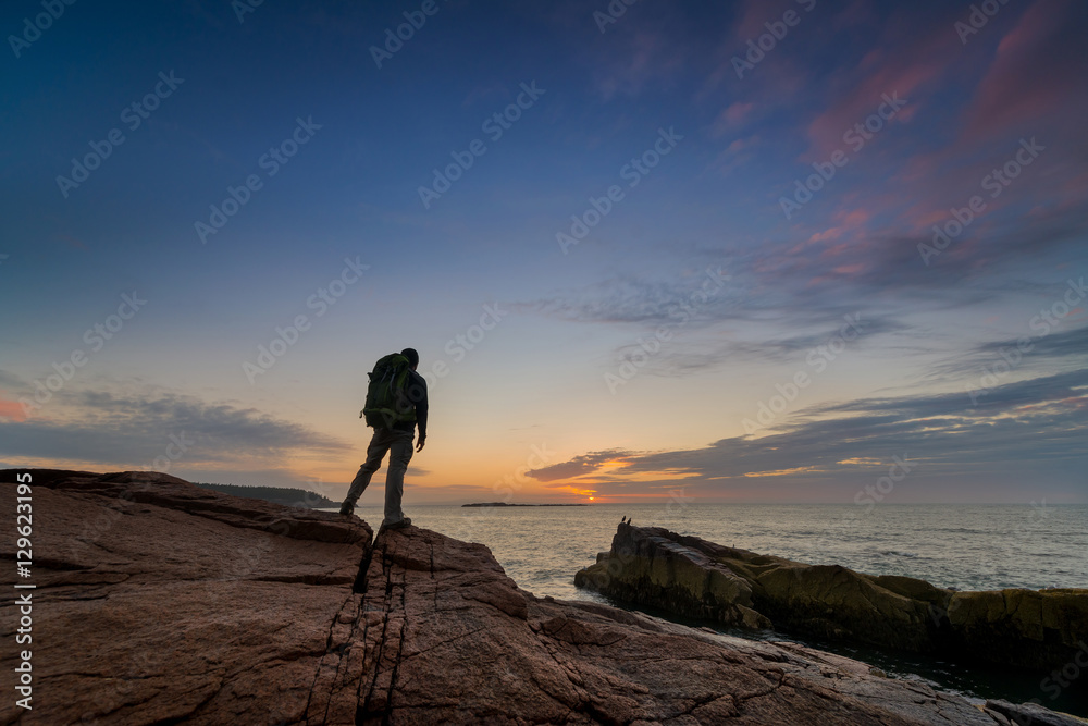 Backpacker Watching the Sunrise in Acadia National Park 