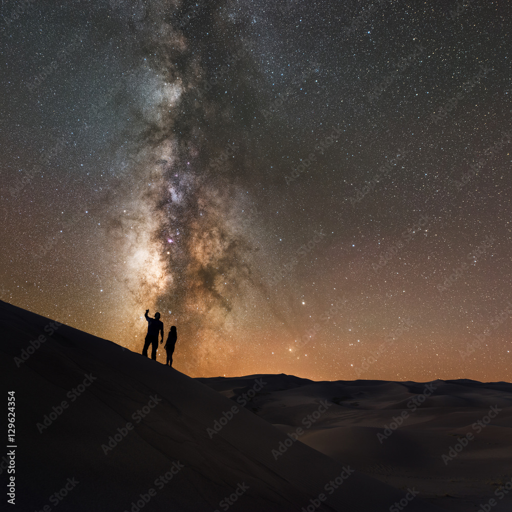A couple looking at the Stars from a Sand Dune 