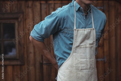 Man wearing apron at home brewery