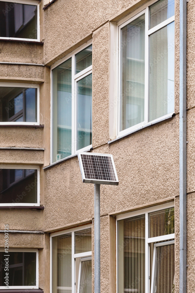 Small solar panel near a block of flats