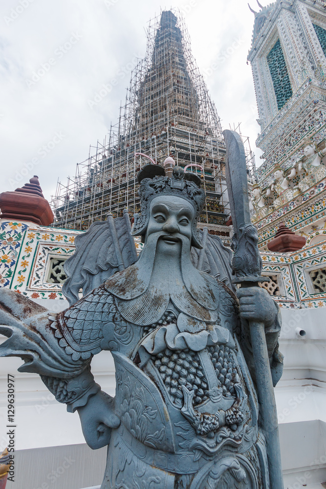 Fototapeta premium Statue Chinese ,The Chinese Stone Figurines of Wat Arun is a Buddhist temple in Bangkok Yai district of Bangkok, Thailand, on the Thonburi west bank of the Chao Phraya River.