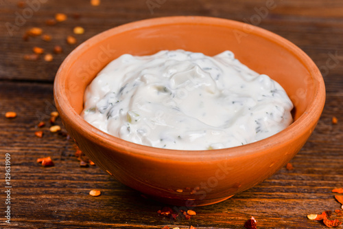 White sauce on a wooden table