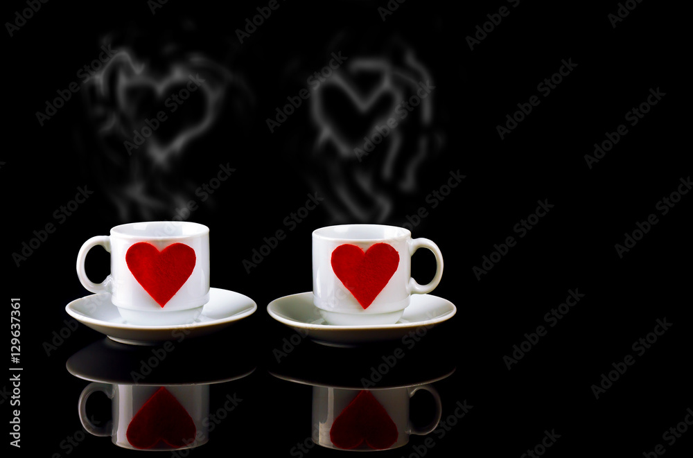 Fototapeta premium two cups with hearts and steam in the form of heart a reflection on a black background