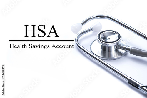 Page with HSA (Health Savings Account) on the table with stethos photo