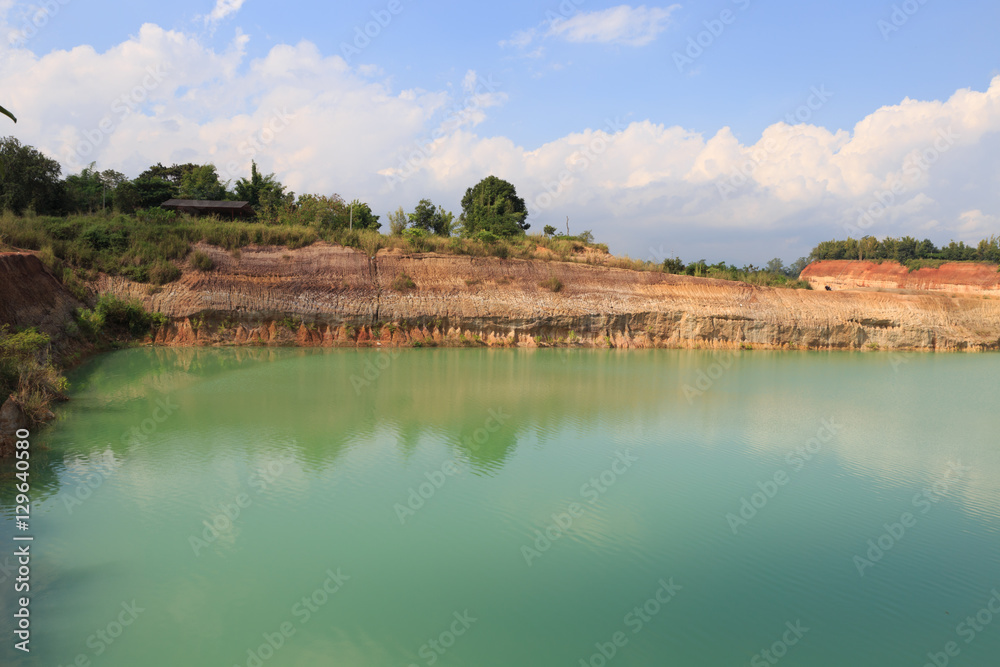 orange valley hill and green water pond lake