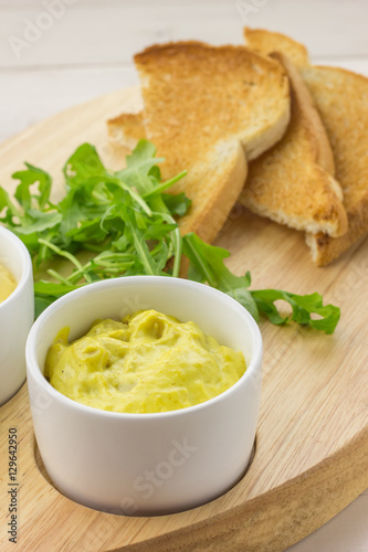 Curried chicken salad, rocket salad and toast photo