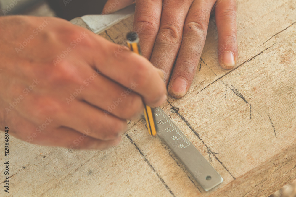 Carpenter working on raw wood. Carpenter working on raw wood.