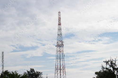 Mobile phone tower silhouette with blue sky