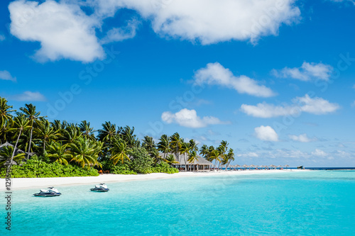 Beautiful beach with clear water and blue sky in Maldives.