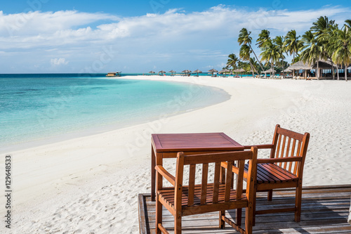 Beautiful beach with clear water and blue sky in Maldives.