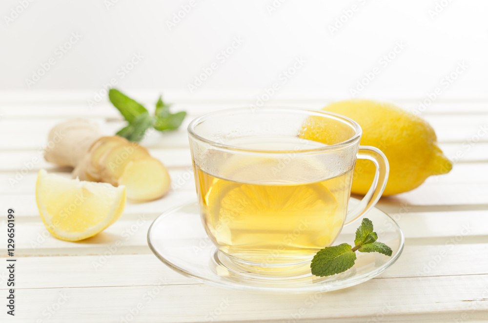 drink of lemon and ginger on white wooden table drink of lemon and ginger on white wooden table