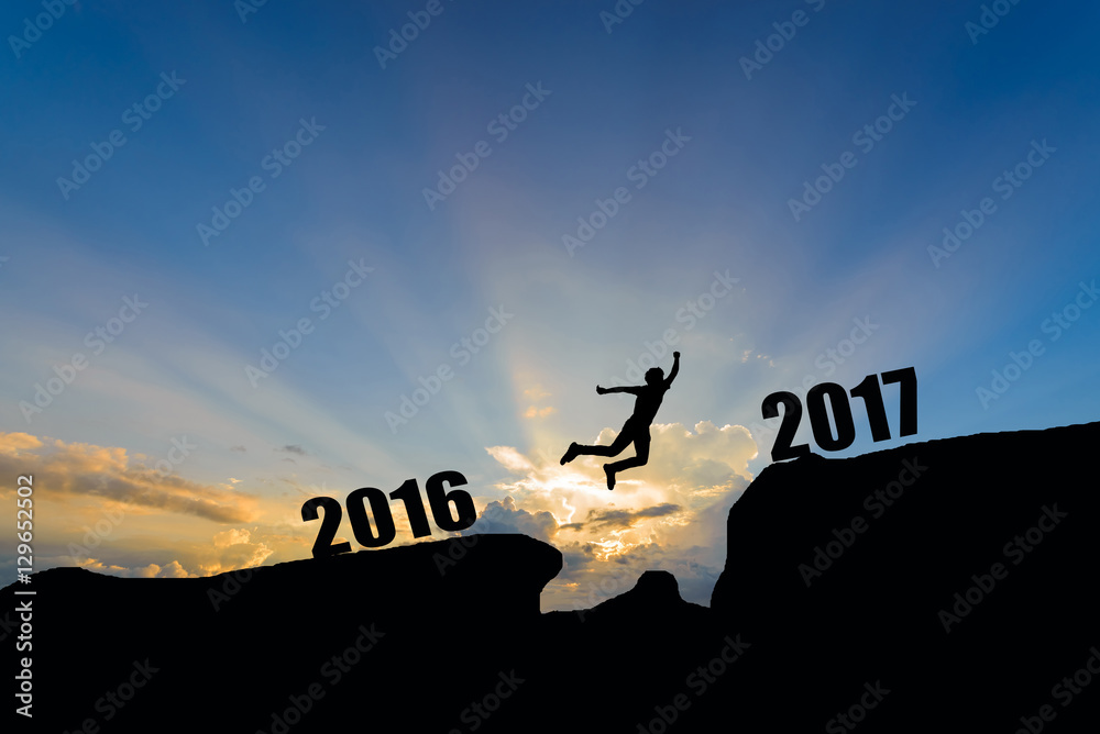 man jump between 2016 and 2017 years on sunset background. man jump between 2016 and 2017 years on sunset background.