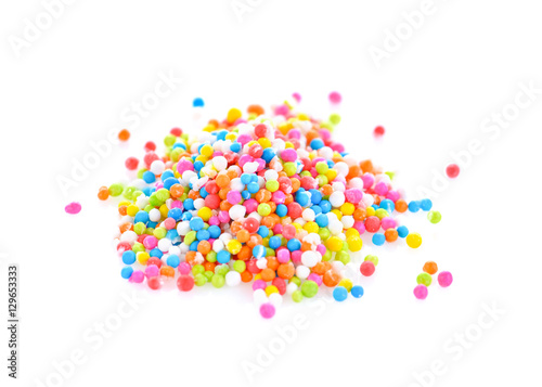 colorful sugar sprinkles on white background