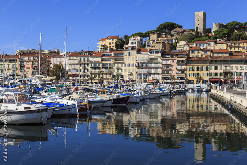 Reflections of boats and Le Suquet, Old (Vieux) port, Cannes, Cote d'Azur, Alpes Maritimes, Provences, France, Mediterranean Reflections of boats and Le Suquet, Old (Vieux) port, Cannes, Cote d'Azur, Alpes Maritimes, Provences, France, Mediterranean