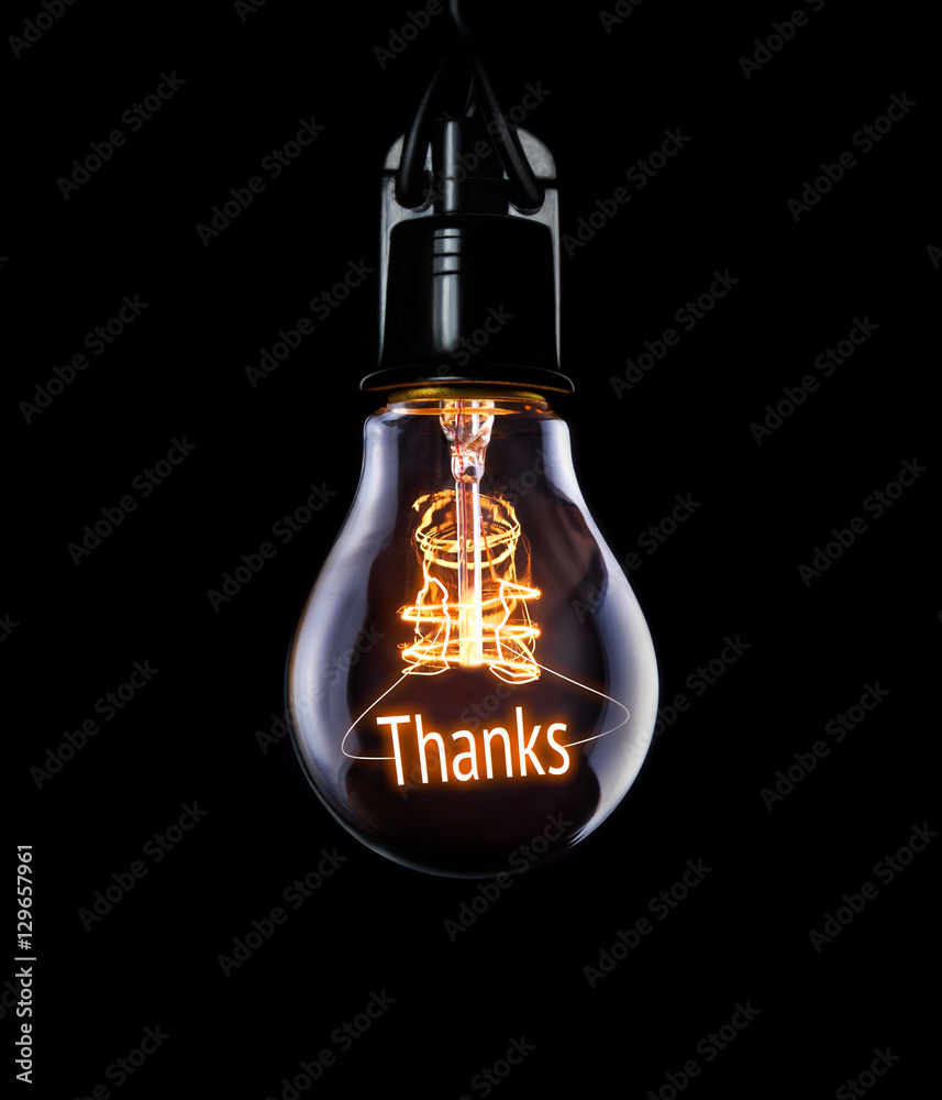 Hanging lightbulb with glowing Thanks concept.
