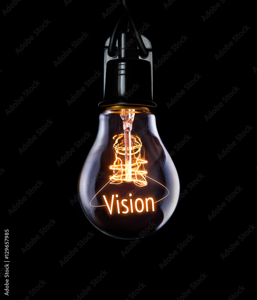 Hanging lightbulb with glowing Vision concept.