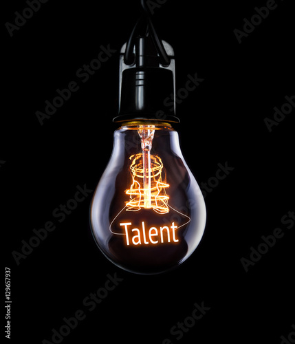 Hanging lightbulb with glowing Talent concept.