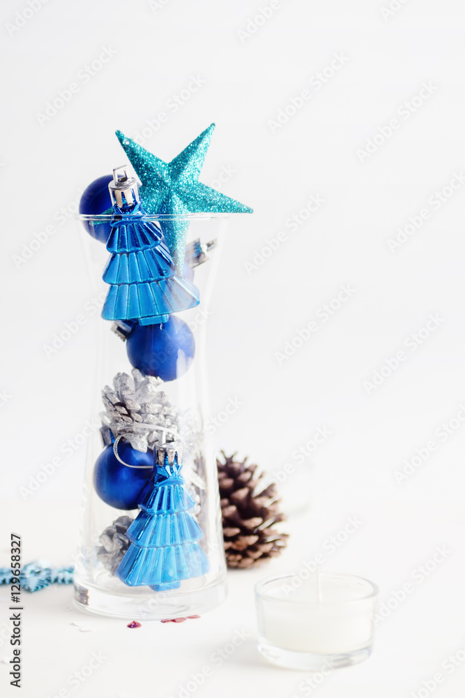 blue and silver Fir-cones and christmas toys in glass