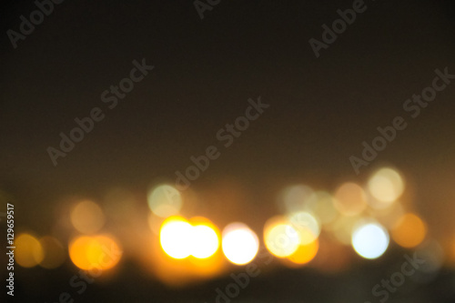 Abstract background of blurred city lights with bokeh effect © olyasolodenko