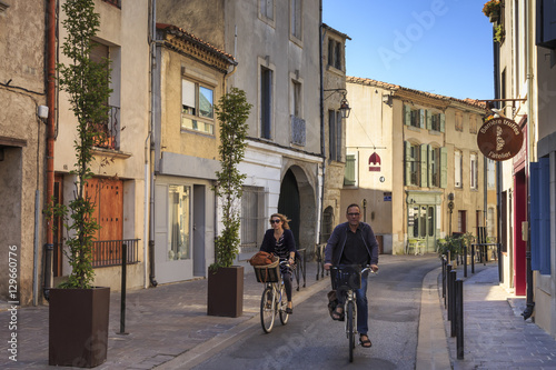 Cyclists in a Ville Basse narrow street, Carcassonne, Languedoc-Roussillon, France