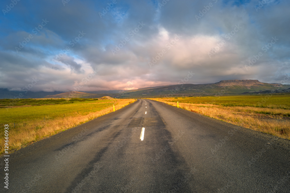 Isolated road and Icelandic landscape at Iceland, summer
