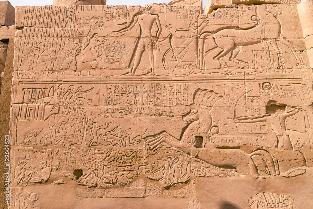Naklejka premium LUXOR, EGYPT: Ancient ruins of Karnak temple in Egypt at noon. The complex is a vast open-air museum, and the second largest ancient religious site in the world