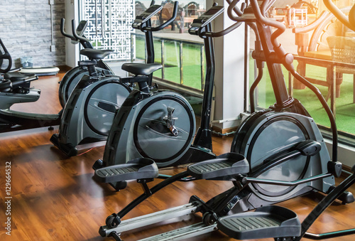 rows of stationary bike in gym modern fitness center room