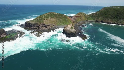 Cinematic flight along rugged coastline around Cape Schanck Pulpit Rock. Mornington Peninsula, Melbourne, Australia.