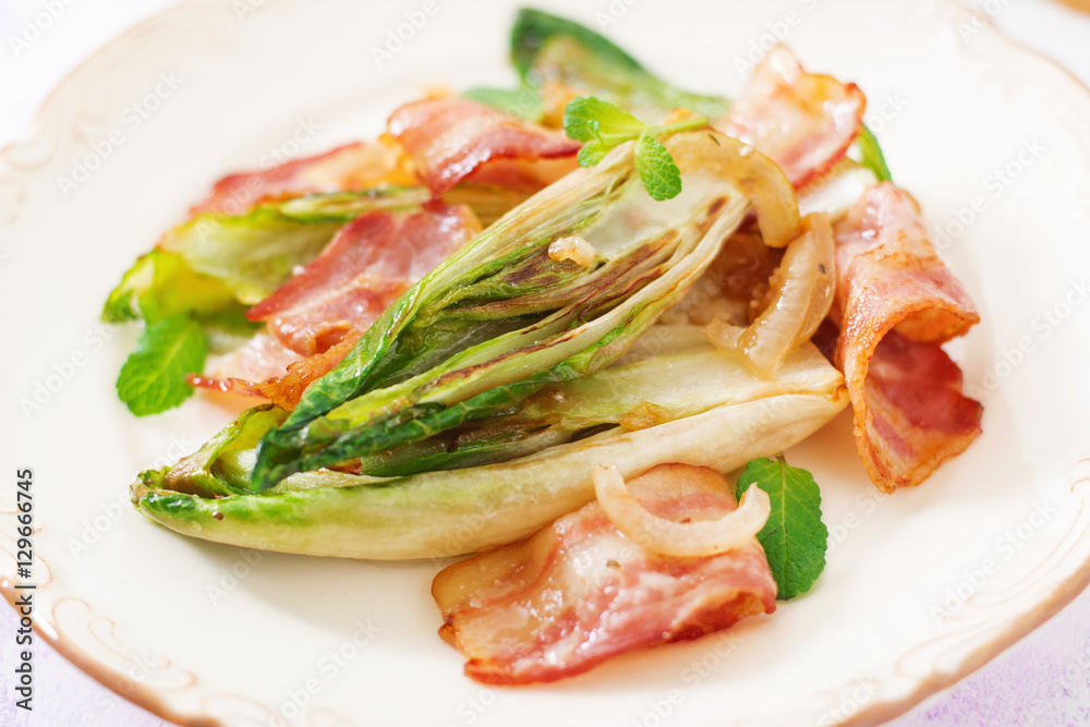 Baked chicory with bacon, onions and herbs. Baked chicory with bacon, onions and herbs.