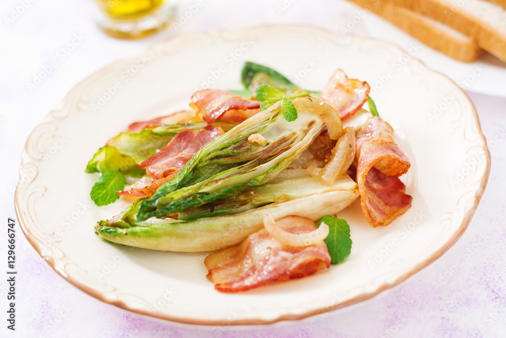 Baked chicory with bacon, onions and herbs.