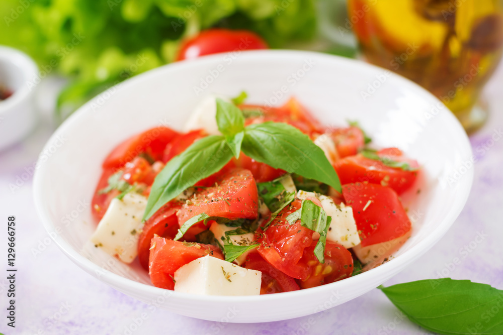 Fresh salad with tomato, mozzarella and basil