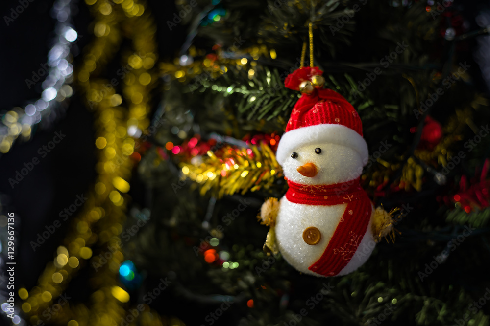 close up soft focus snowman on blurry christmas tree backgroud close up soft focus snowman on blurry christmas tree backgroud