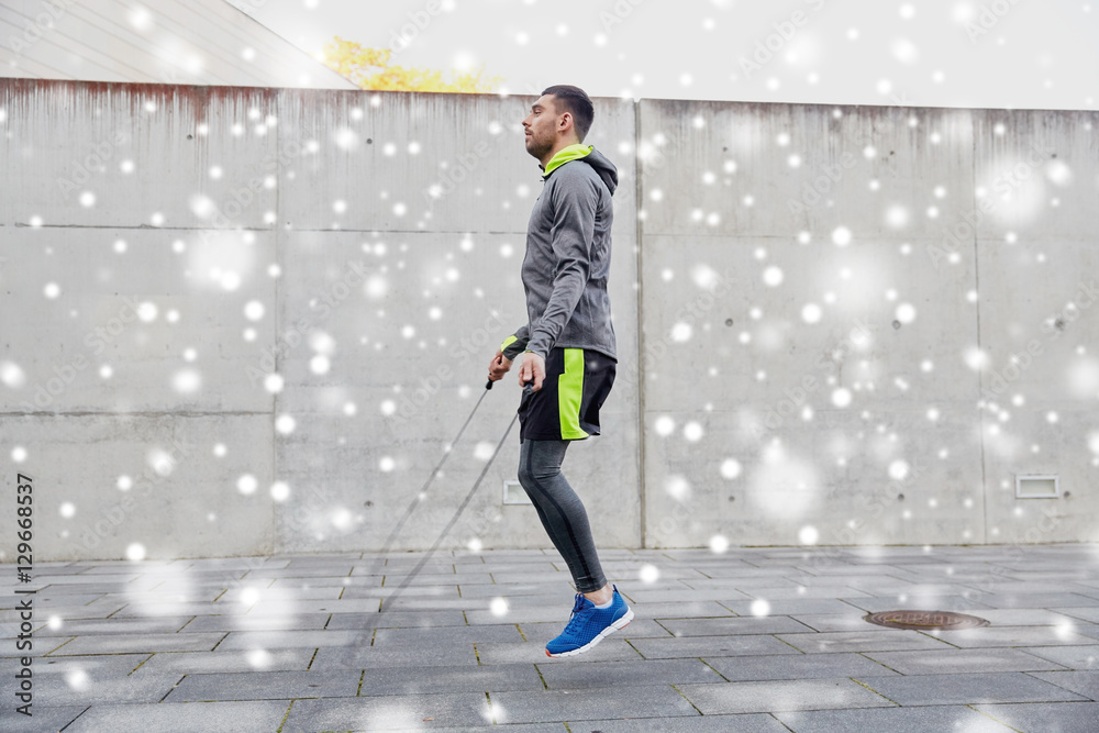 man exercising with jump-rope outdoors man exercising with jump-rope outdoors