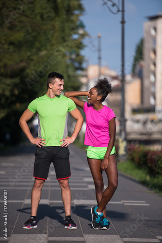 portrait of young multietnic jogging couple ready to run