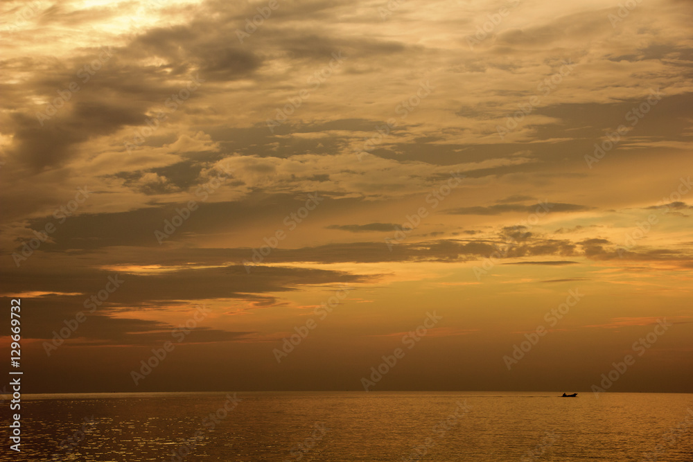 Landscape of sky and sea which has small fishing boat in morning ; Songkhla province Thailand (can use as background)
