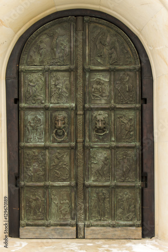 old church textured door with stone arch facade